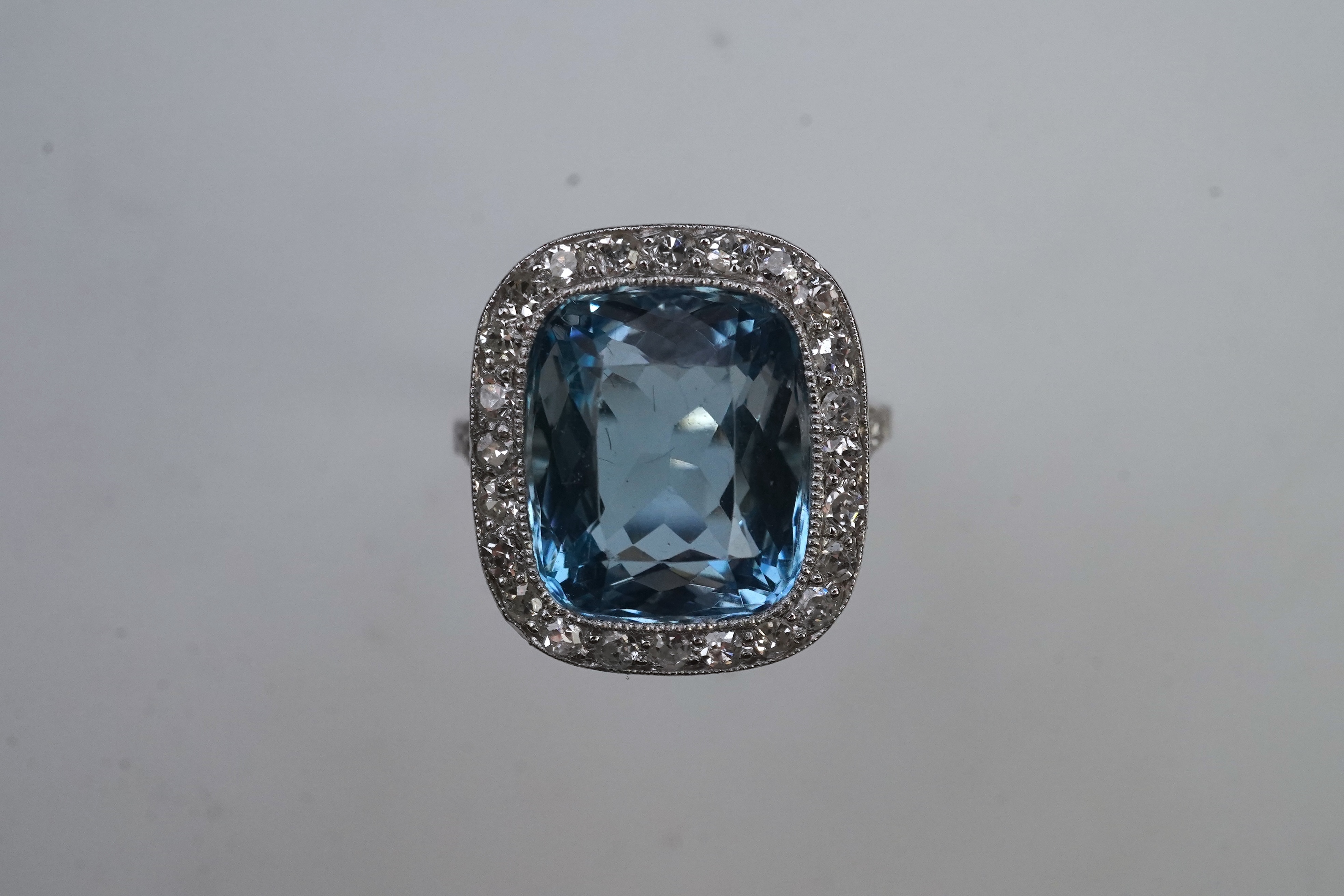An attractive aquamarine and diamond ring